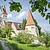 Das Motiv zeigt die Gredinger Stadtmauer mit Kusslerturm und Martinsbasilika.